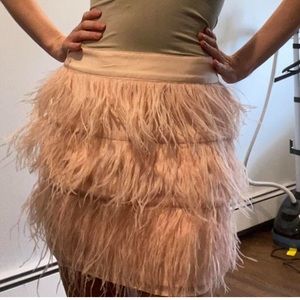 Fun and Flirty pink feathery skirt.